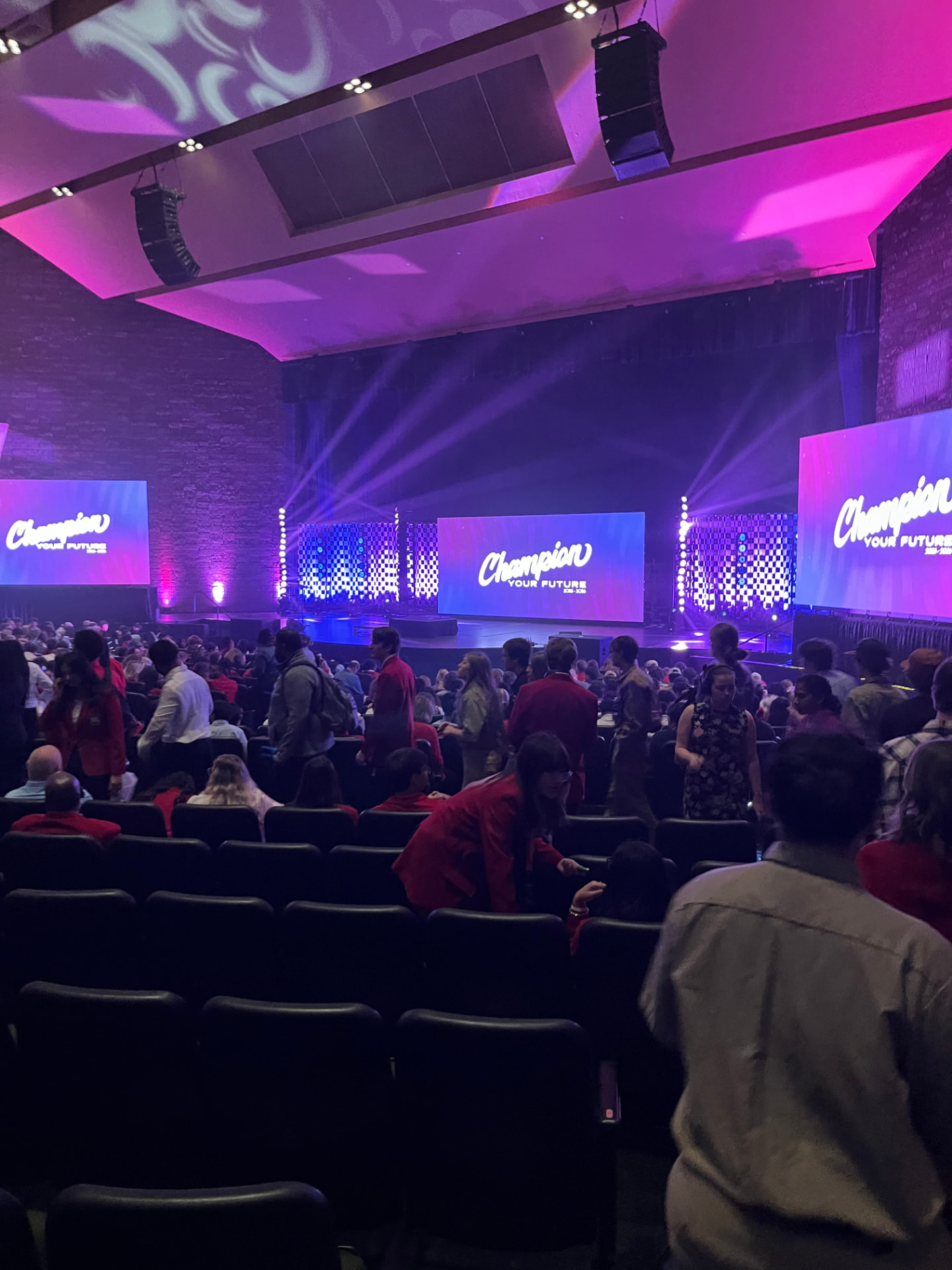 SkillsUSA national conference main stage lit in purple during a general session